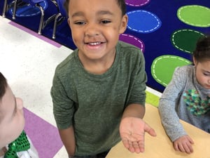 Excited Young Man Holding a Seed to Plant